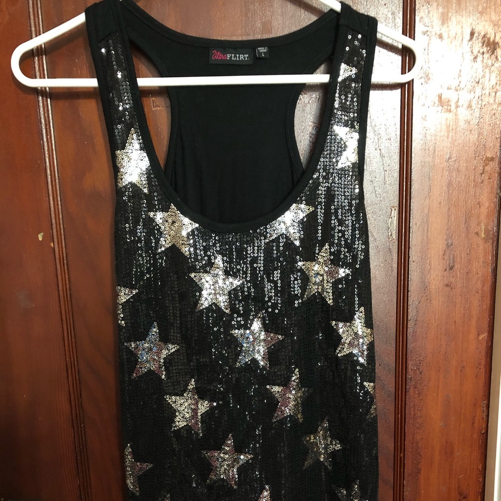 Sequined silver star black tank top.